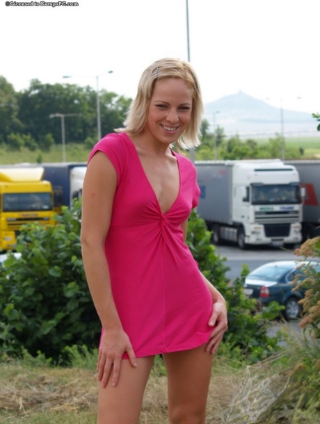 Playful amateur teen strips to flash her tight pussy outdoor