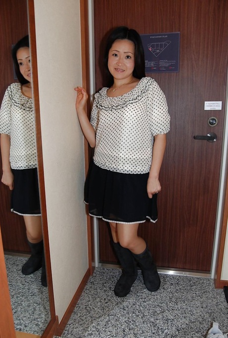 Splendid Asian brunette Takako Makino is a frisky milf with hairy cunt