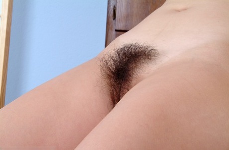 Latina model Nancy poses in an amateur shoot displaying her hairy cunt
