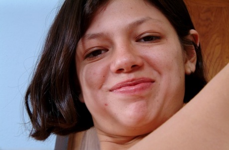 Latina model Nancy poses in an amateur shoot displaying her hairy cunt