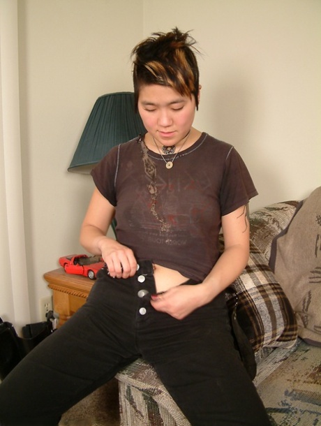 Amateur Asian chick Cady removes sexy boots and bares hairy cooter