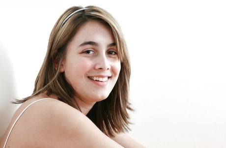 18 year old amateur Cleo undressing to flaunt all natural boobs