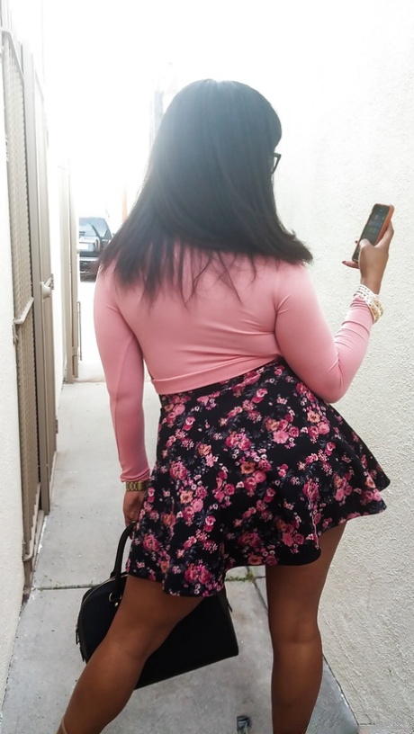 Busty black girl Porsha Carrera bends over in high heels for upskirt