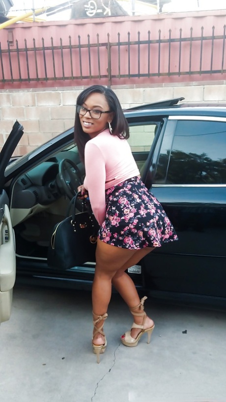Busty black girl Porsha Carrera bends over in high heels for upskirt