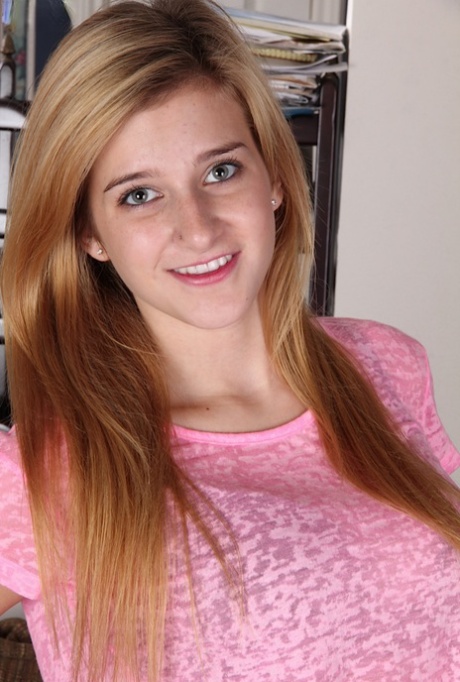 Blonde teener Karma Jones posing for close up topless solo girl shoot