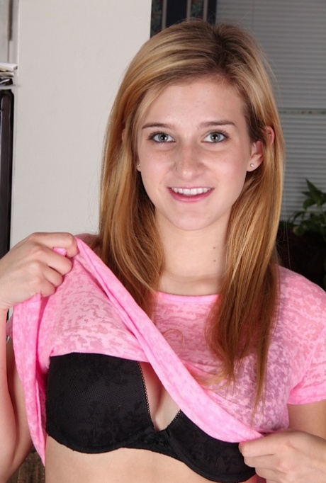 Blonde teener Karma Jones posing for close up topless solo girl shoot