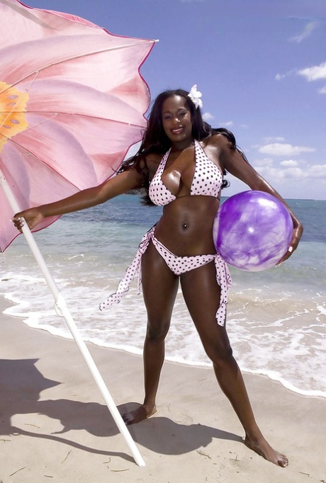 Black mom Nikki Jaye freeing huge juggs from bikini outdoors on beach