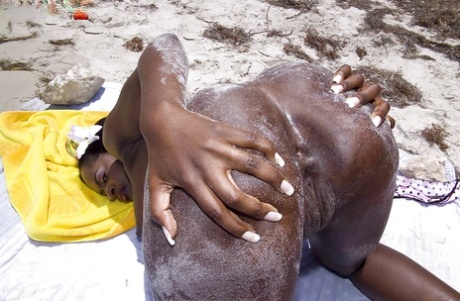 Black mom Nikki Jaye freeing huge juggs from bikini outdoors on beach