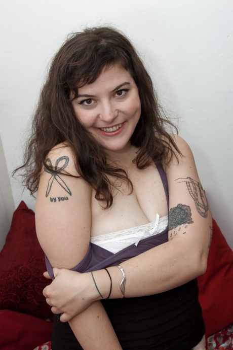 Fatty tattooed babe in socks Esther stripping and posing on the bed