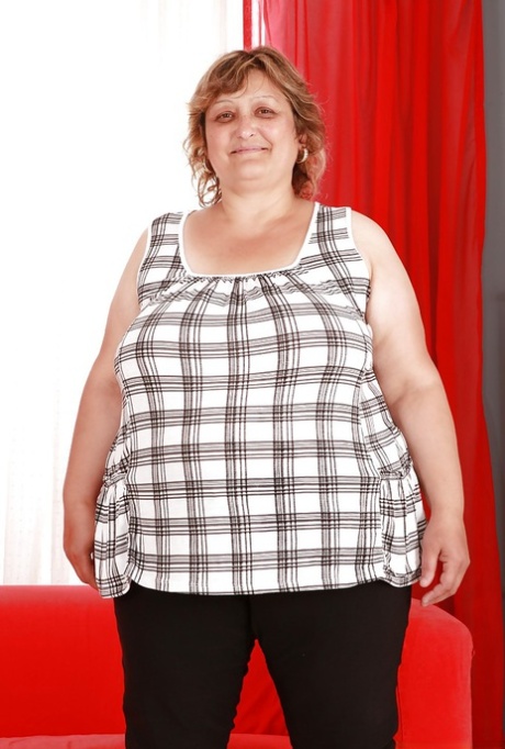 Fatty granny with huge boobs and ass stripping and spreading her legs