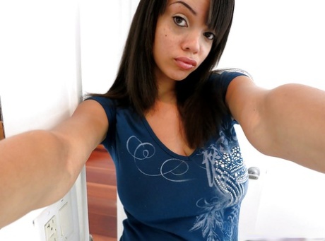 Bosomy ebony amateur Stacey Foxxx getting naked and picturing herself