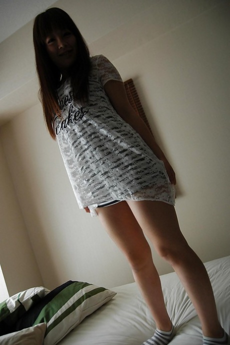 Cute asian teen Yui Oonuki strips down and exposes her cunt in close up