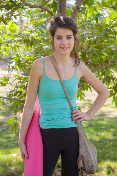 Teen girlfriend Ingrid Hayes teases with her ass in hot tights outdoors