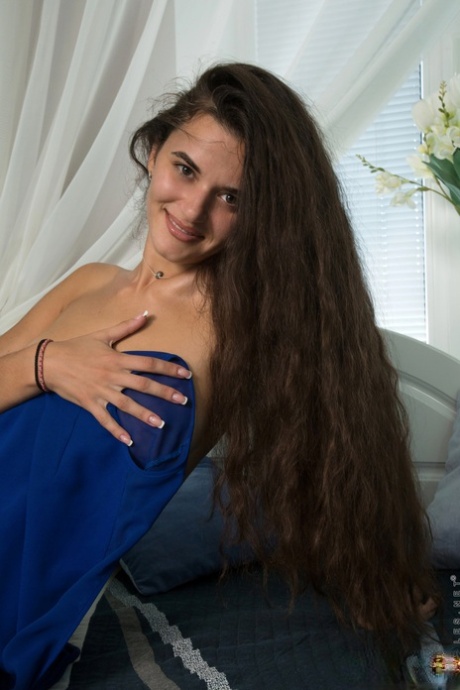 Teen with small tits Erika Rose stripping and fondling her tasty vagina