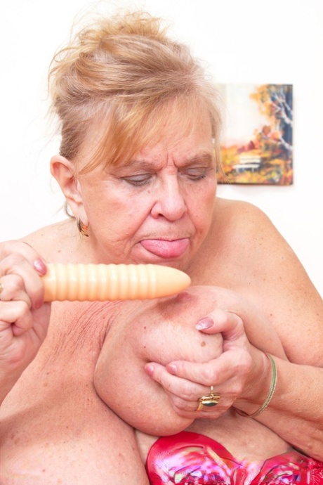 Old fat granny Darla revelas her huge tits and masturbates in a solo