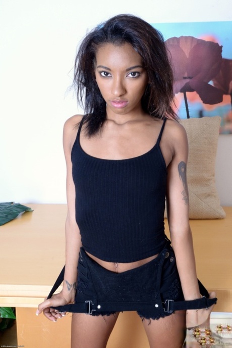 Slender ebony with tiny tits Raven Wylde spreads her delicious pussy