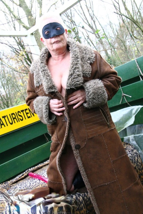 Fat short-haired granny Ilse W toying her big tits & pussy in public