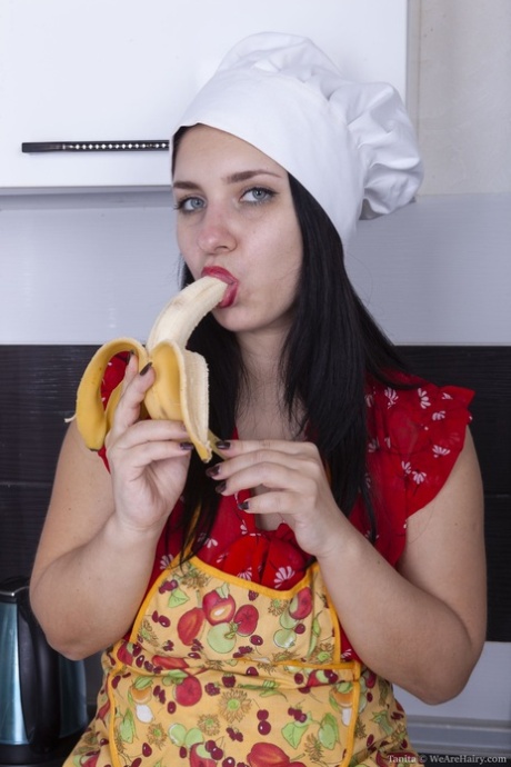Sexy teen with natural tits Tanita flaunts her hairy pussy in the kitchen