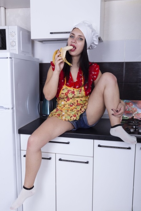 Sexy teen with natural tits Tanita flaunts her hairy pussy in the kitchen