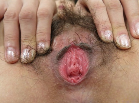 Cute Japanese babe Ami Manaka gets her hairy pink pussy fingered & toyed
