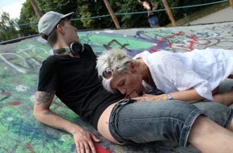 Blonde MILF Victoria gets her mature pussy fucked by a teen skater outdoors