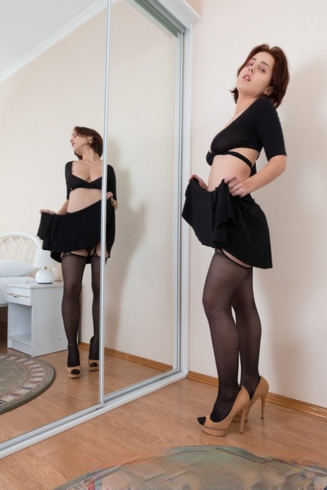 Ukrainian girl Chrystal Mirror fingers her spread hairy pussy from behind