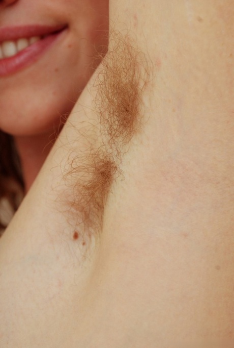 Sexy babe Valcorie poses solo in the bathroom and teases with her hairy cunt