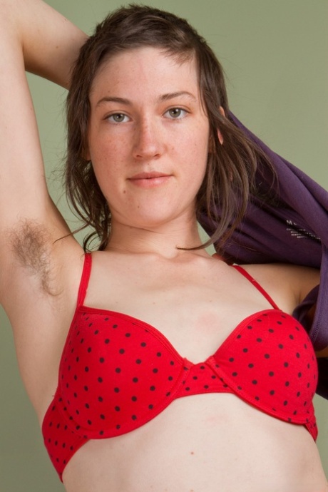 Brunette chic with natural tits May shows her hairy armpits and vagina