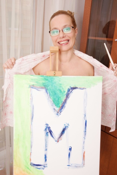 Mature artistic soul Odessa paints her curvy body and pleases herself