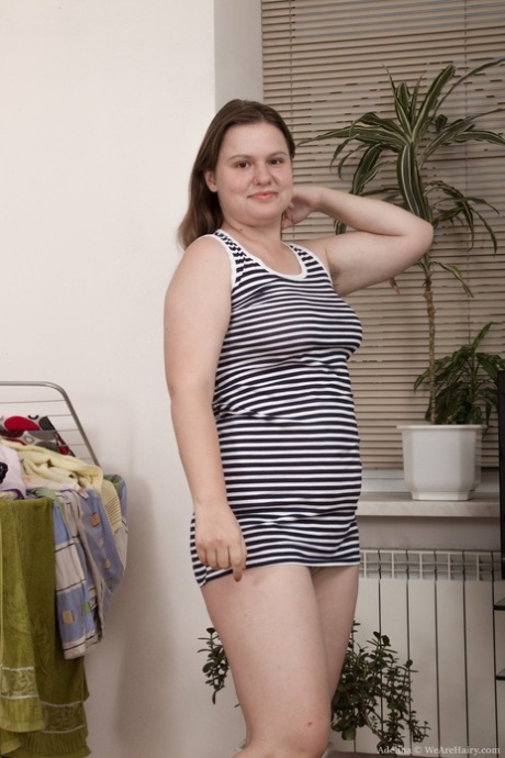 Chubby brunette with big tits Adelina presenting her bushy snatch in solo