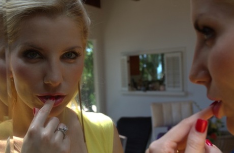 Blonde MILF with natural juggs Ashley Fires bends to show her tight ass