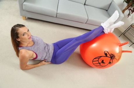 Hottie Dominika K strips and shows her amazing boobs while bouncing on ball