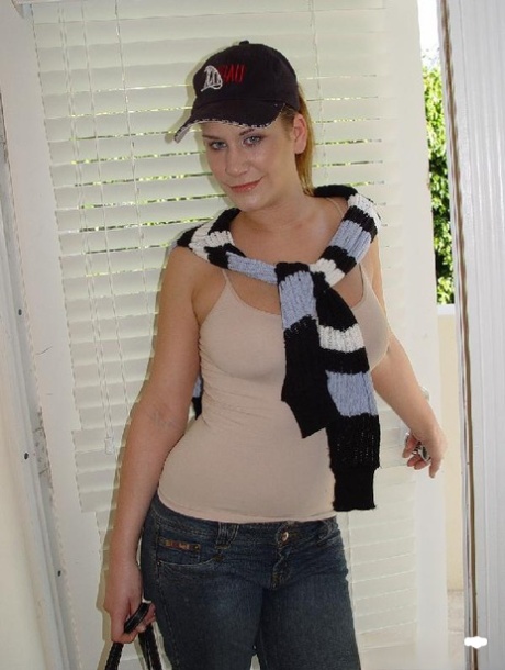 Curvy brunette takes off her jeans, shows her large butt and natural tits