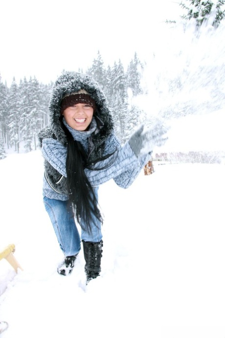 Brunette girl with huge boobs Ora drills her twat with a toy in the snow