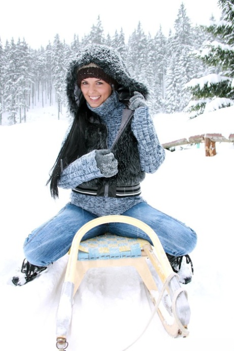 Brunette girl with huge boobs Ora drills her twat with a toy in the snow