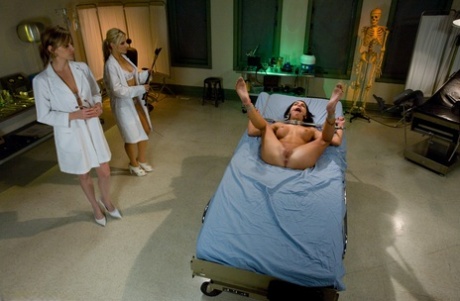 Two dirty MILF doctors with big tits restrain and toy their submissive patient