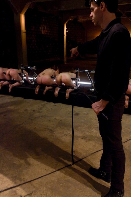 Bound slave girls are made to eat pussy by their master in a BDSM orgy