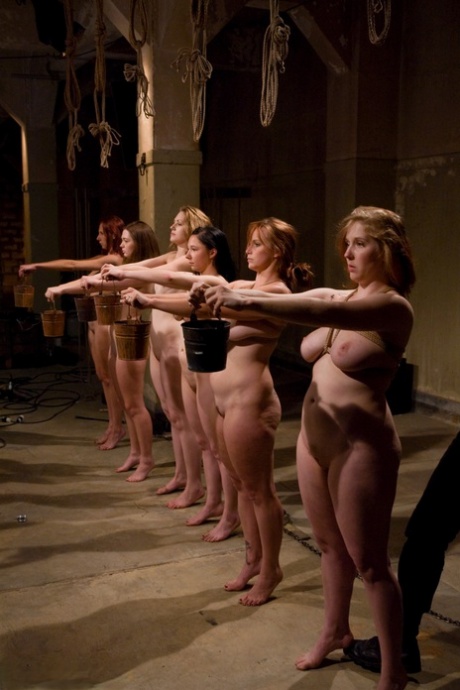 Bound slave girls are made to eat pussy by their master in a BDSM orgy