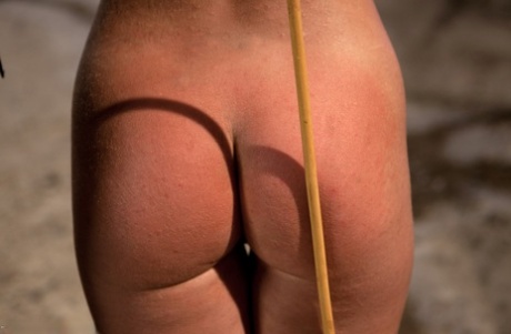 Petite teens watch while a blonde girl gets disciplined with clamps & a paddle
