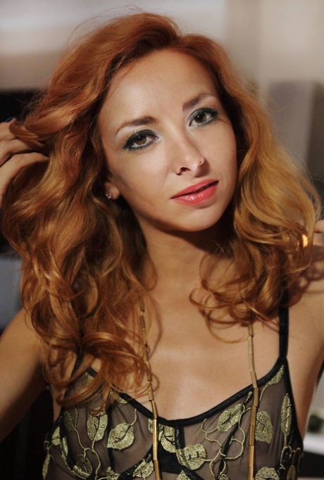 Sexy redheaded babe Vetta reveals her small boobs & rubs her twat on the floor