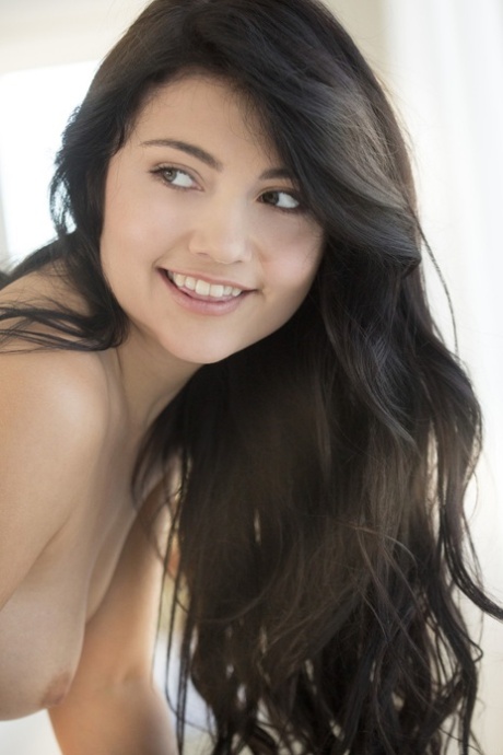 Kink teen Adria Rae unveils her tiny breasts and poses naked in a solo