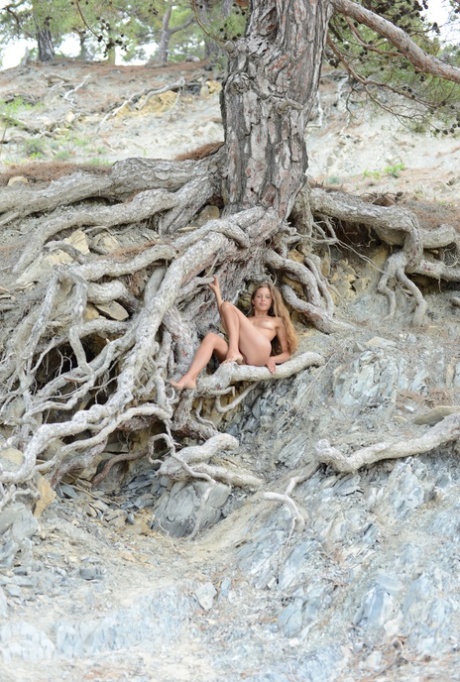 Kinky teen Geisha B gets rid off her clothes and flaunts her bush outdoors