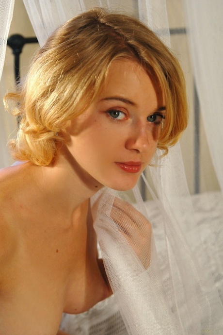 Pretty teen Magdalena poses seductively completely naked on her bed