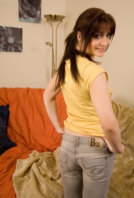 Small titted brunette babe Aideen undresses and rubs her pussy in a solo