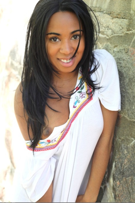 Glamorous ebony teen Tahela loses her white dress & shows her curvaceous body