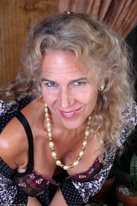 Kinky mature Sabrina P shows her big juggs and rubs her clam in a solo