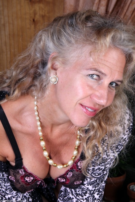 Kinky mature Sabrina P shows her big juggs and rubs her clam in a solo