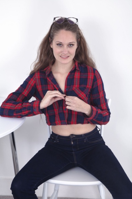 Brunette amateur Sacha spreads her hairy pussy while sitting on a table