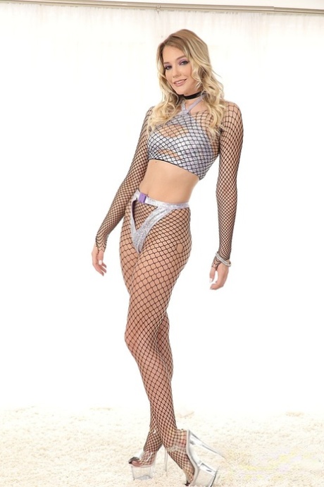 Skinny blonde in hot fishnets Kenna James flaunts her titties and asshole