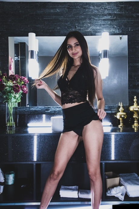 Skinny teen pornstar Eliza Ibarra exposes her boobs and rubs her hairy muff
